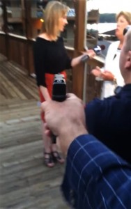 In this framegrab from video posted on Bryce Williams Twitter account and Facebook page, Williams, whose real name is Vester Lee Flanagan II, aims a gun over the shoulder of WDBJ-TV cameraman Adam Ward at reporter Alison Parker as she conducts a live on-air interview Wednesday, Aug. 26, 2015. Moments later, Flanagan fatally shot Parker and Ward and injured Vicki Gardner, who was being interviewed. The station said Flanagan was also an employee at WDBJ and appeared on air as Bryce Williams. (Vester Lee Flanagan II/Twitter via AP)