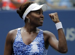 Venus Williams, of the United States, reacts to her coach's box after defeating Belinda Bencic, of Switzerland, during the third round of the U.S. Open tennis tournament, Friday, Sept. 4, 2015, in New York. (AP Photo/Matt Rourke)