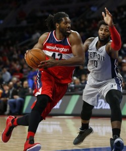 Washington Wizards forward Nene Hilario (42) drives on Detroit Pistons center Andre Drummond (0) in the second half of an NBA basketball game Saturday, Nov. 21, 2015 in Auburn Hills, Mich. (AP Photo/Paul Sancya)