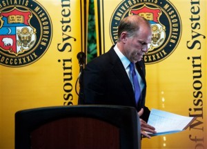 University of Missouri System President Tim Wolfe announces his resignation from office Monday, Nov. 9, 2015, during a UM System Board of Curators meeting in University Hall at the University of Missouri in Columbia, Mo. Wolfe has been under fire for his handling of race complaints that had threatened to upend the football season and moved one student to go on a hunger strike. (Nick Schnelle/Columbia Daily Tribune via AP) MANDATORY CREDIT