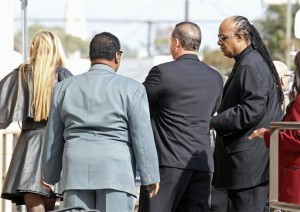 Singer Stevie Wonder, far right, arrives for the funeral of singer Natalie Cole at West Angeles Church of God in Christ in the Crenshaw district of Los Angeles, Monday, Jan. 11, 2016. Cole died on New Year's eve at age 65. (AP Photo/Nick Ut)