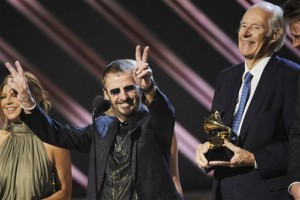 In this Feb. 10, 2008, file photo, musician Ringo Starr, center, and Beatles producer Sir George Martin accept the best compilation soundtrack album award for "Love" during the 50th annual Grammy awards held at the Staples Center in Los Angeles. George Martin, the producer who guided the Beatles to astounding heights, has died, his manager said on March 9, 2016. He was 90. (AP Photo/Kevork Djansezian, File)