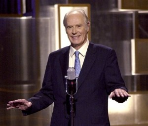FILE - In this March 29, 2001, file photo, Sir George Martin, the Beatles producer, makes an appearance during "An All-Star Tribute to Brian Wilson" concert at New York's Radio City Music Hall. George Martin, the Beatles' urbane producer who guided, assisted and stood aside through the band's swift, historic transformation from rowdy club act to musical and cultural revolutionaries, has died, his management said Wednesday, March 9, 2016. He was 90. (AP Photo/Stephan Chernin, File)