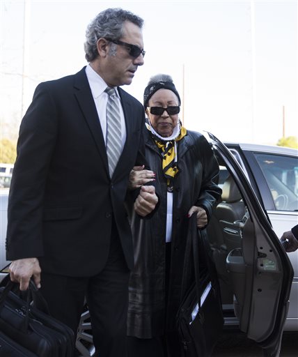 Prince's half-sister Sharon Nelson, accompanied by her attorney Ken Abdo, arrives at the Carver County Justice Center in Chaska, Minn., Monday, May 2, 2016. With the approval of most of Princes siblings, Carver County District Court Judge Kevin Eide confirmed the appointment of Bremer Trust, National Association as special administrator to manage the late musicians assets during a probate hearing. (Leila Navidi/Star Tribune via AP)