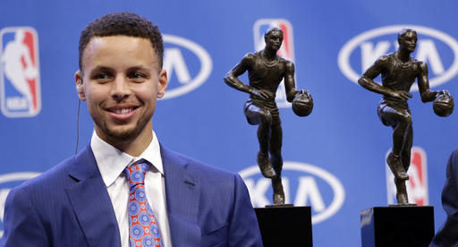 Golden State Warriors guard Stephen Curry conducts interviews after receiving the NBA's Most Valuable Player award at a basketball news conference Tuesday, May 10, 2016, in Oakland, Calif. (AP Photo/Marcio Jose Sanchez)